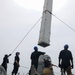 Sailors aboard the USS Howard conduct a missile onload in Yokosuka, Japan