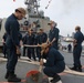Sailors aboard the USS Howard conduct a sea and anchor detail in Yokosuka, Japan