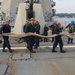 Sailors aboard the USS Howard conduct a sea and anchor detail in Yokosuka, Japan