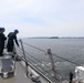Sailors aboard the USS Howard conduct a missile onload and download in Yokosuka, Japan