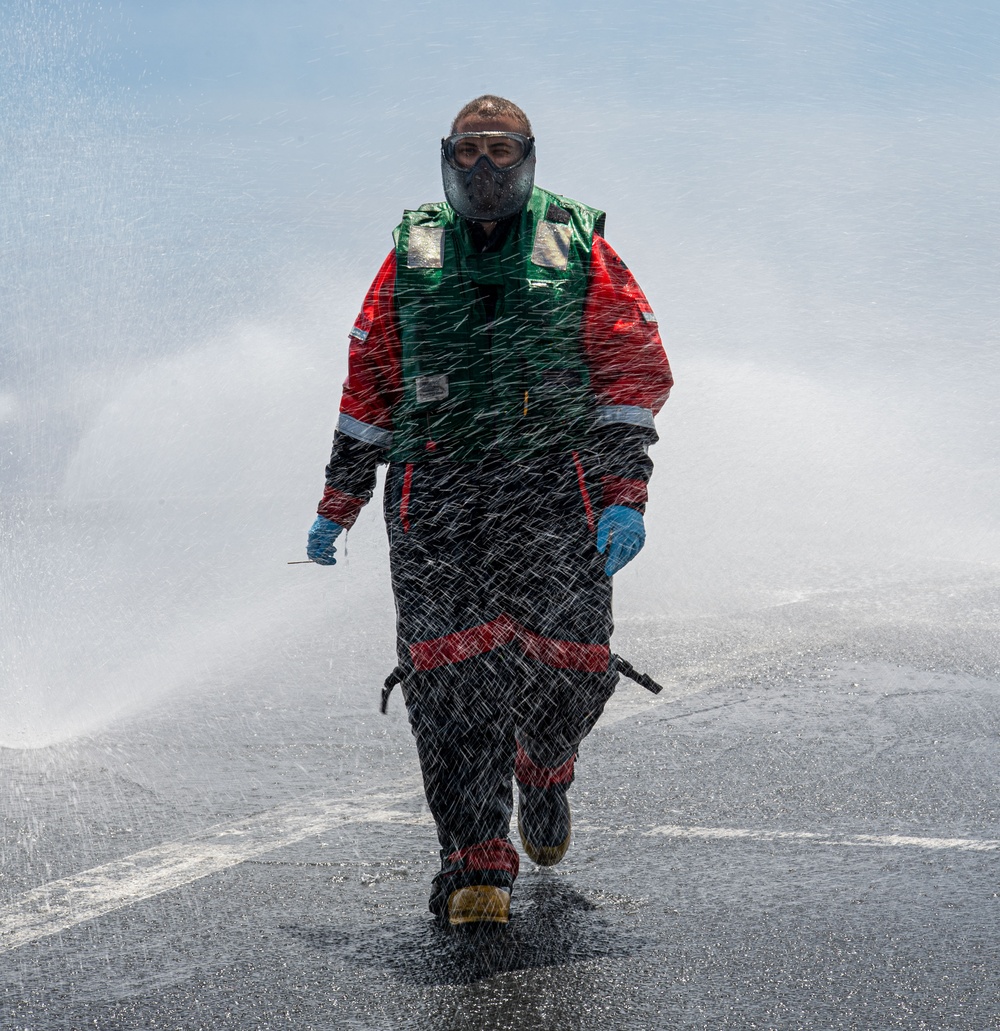 Fireman Observes Countermeasure Washdown