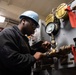 Sailor Cleans Debris