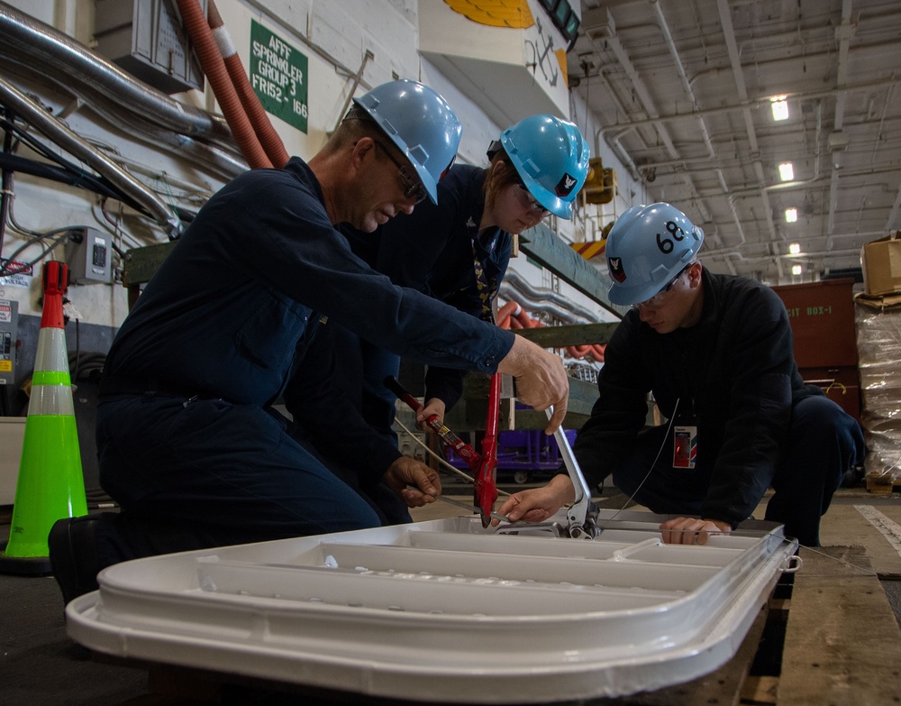 Sailors Perform Maintenance