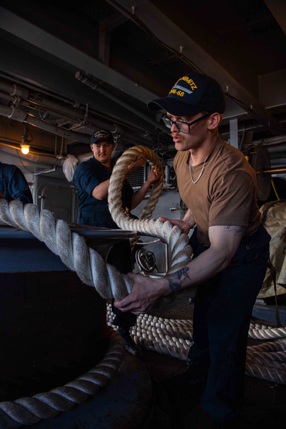 Sailors Handle Mooring Lines