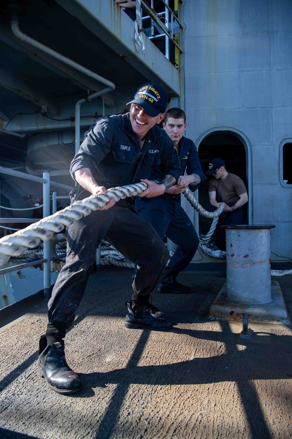 Sailors Heave Around Mooring Line