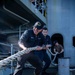 Sailors Heave Around Mooring Line