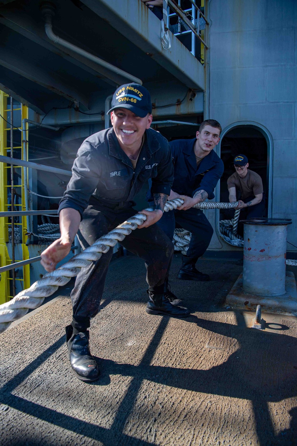 Sailors Heave Around Mooring Line