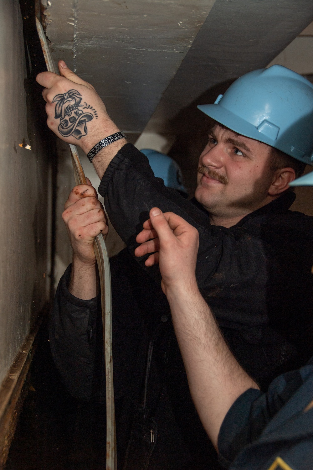 Sailor Replaces Gasket in Weapons Elevator