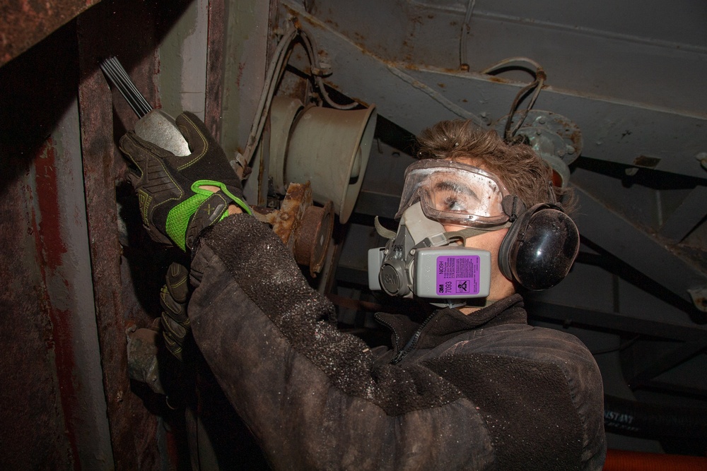 Sailor Conducts Corrosion Control Measures