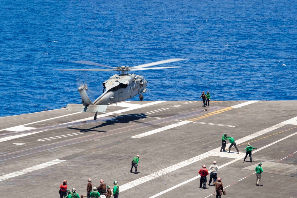 An MH-60S Sea Hawk lands on the flight deck of Nimitz-class aircraft carrier USS Carl Vinson (CVN 70)