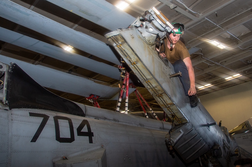 USS Ronald Reagan (CVN 76) Sailors perform maintenance on helicopters