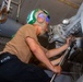 USS Ronald Reagan (CVN 76) Sailors perform maintenance on helicopters
