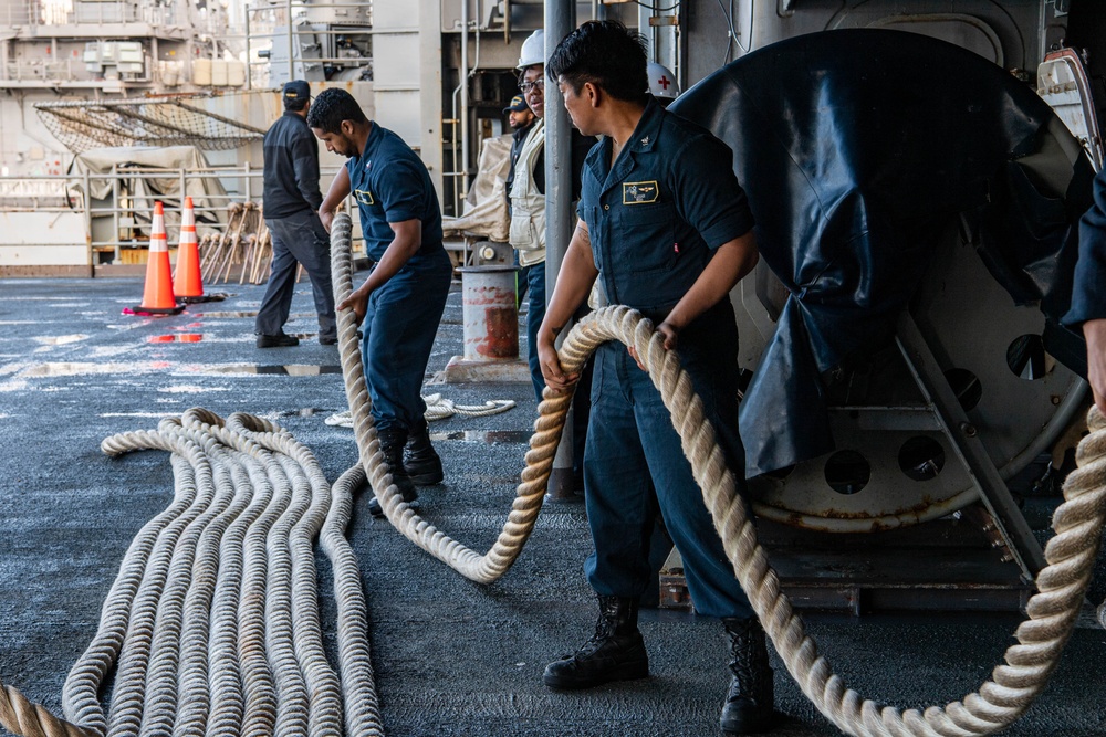 Sailors Handle Mooring Lines