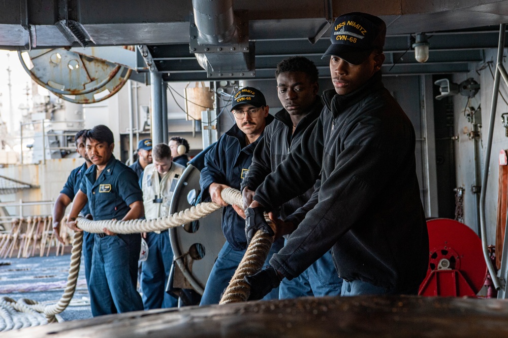 Sailors Handle Mooring Lines