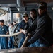 Sailors Handle Mooring Lines