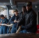 Sailors Handle Mooring Lines