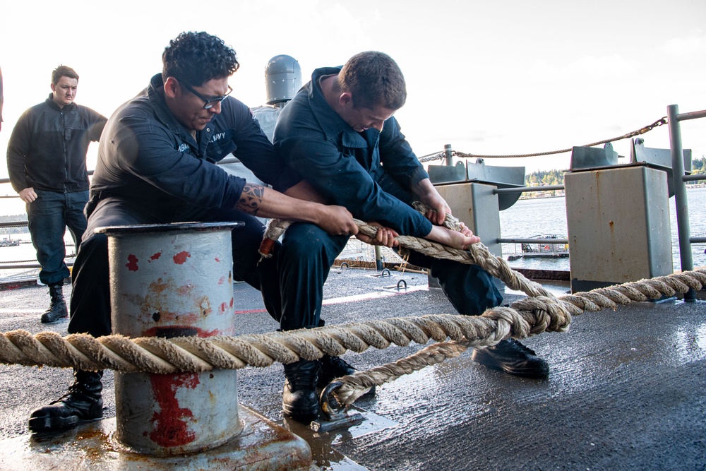 Sailors Handle Mooring Lines