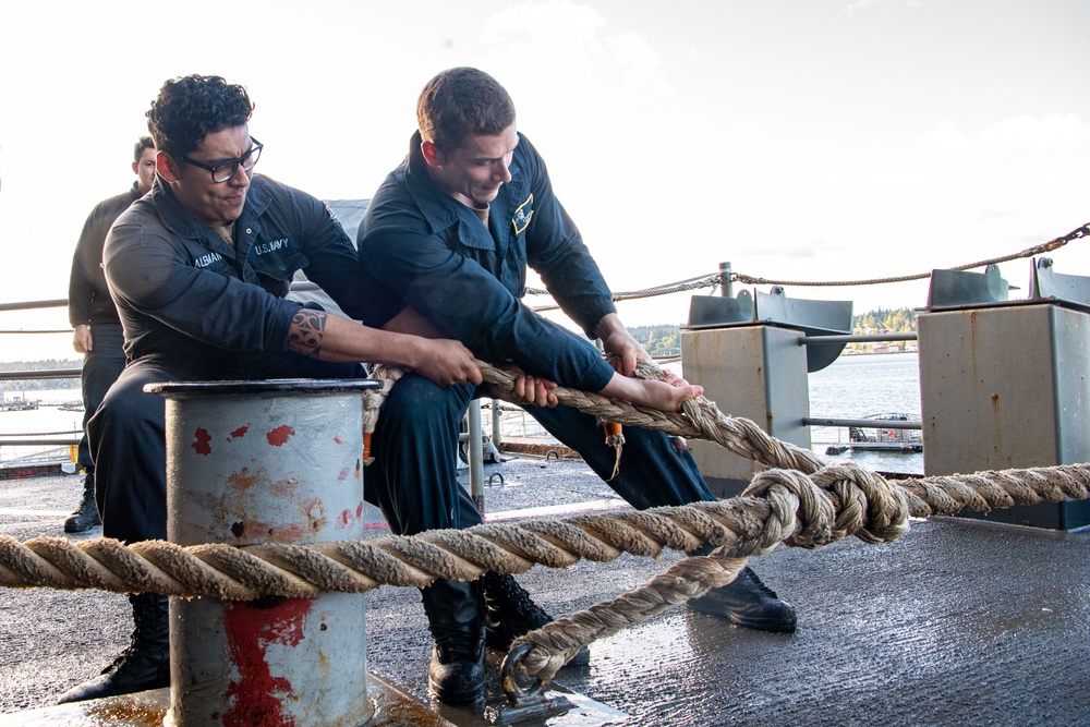 Sailors Handle Mooring Lines