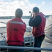 Sailors Fire Shotline From Fantail