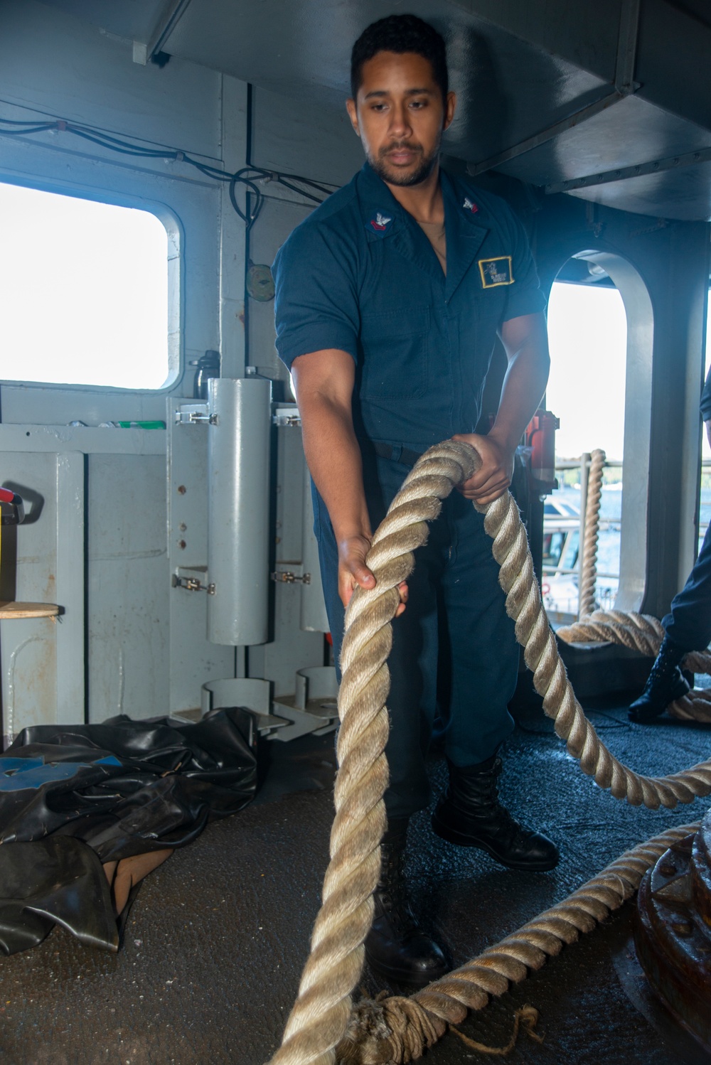 Sailor Heaves Line On The Fantail