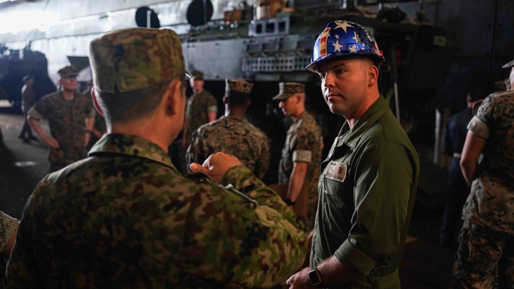 240620 – Distinguished Visitors Board USS Harpers Ferry at Okinawa, Japan