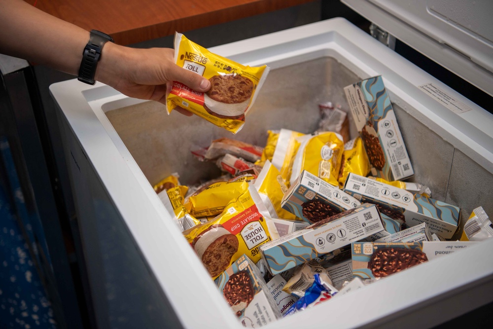 USS Kidd (DDG-100) Sailor Buys Snack