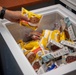 USS Kidd (DDG-100) Sailor Buys Snack