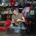 USS Ronald Reagan (CVN 76) Sailors repair equipment