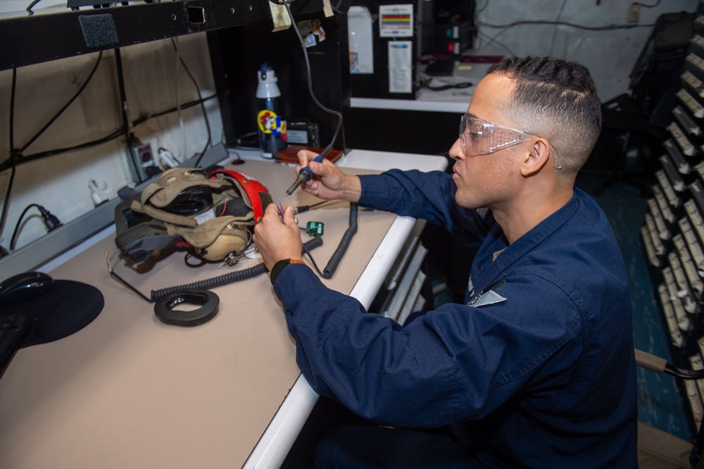 USS Ronald Reagan (CVN 76) Sailors repair equipment