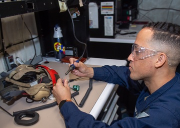USS Ronald Reagan (CVN 76) Sailors repair equipment