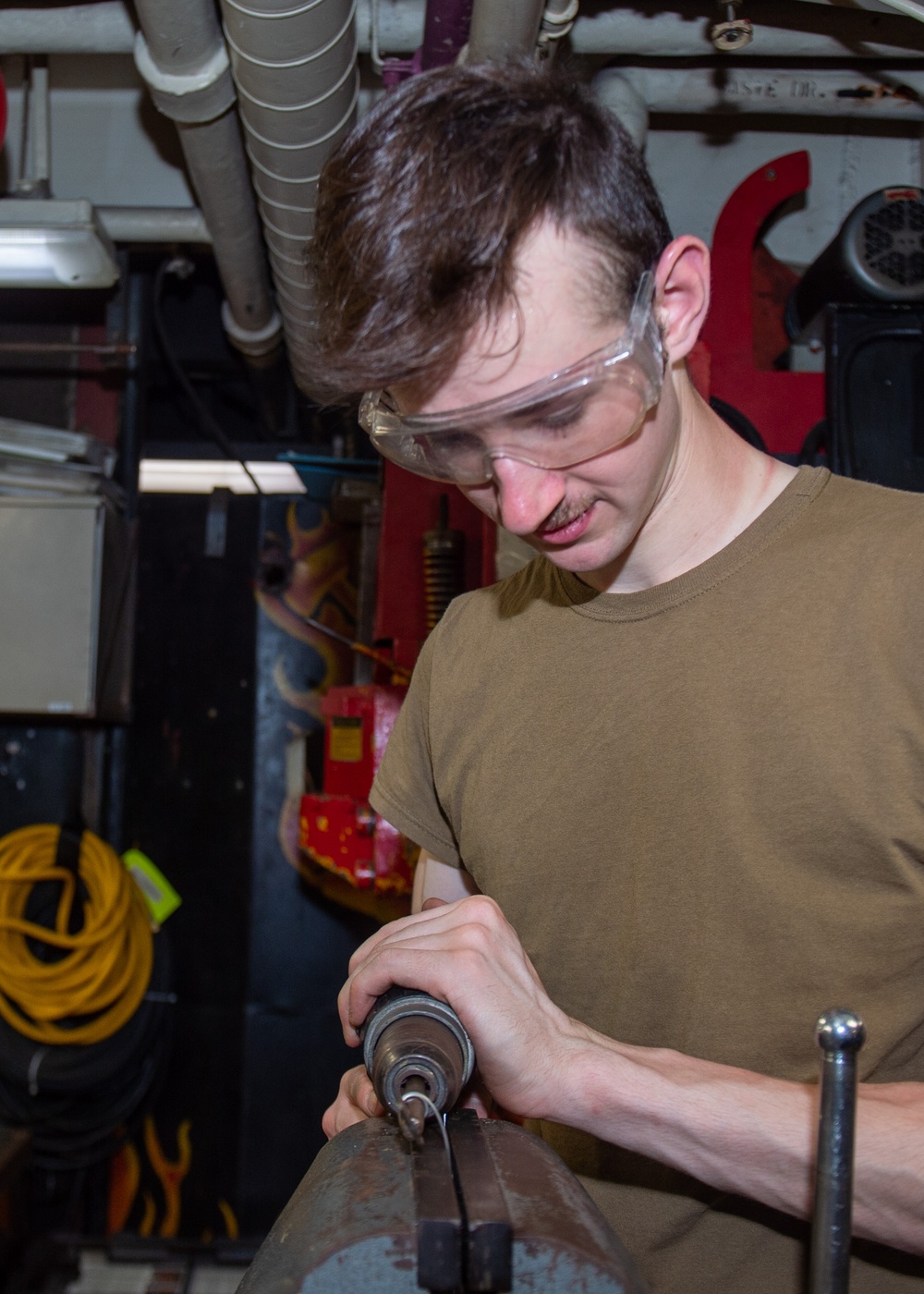 USS Ronald Reagan (CVN 76) Sailors repair equipment