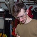 USS Ronald Reagan (CVN 76) Sailors repair equipment