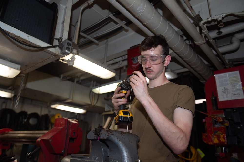 USS Ronald Reagan (CVN 76) Sailors repair equipment