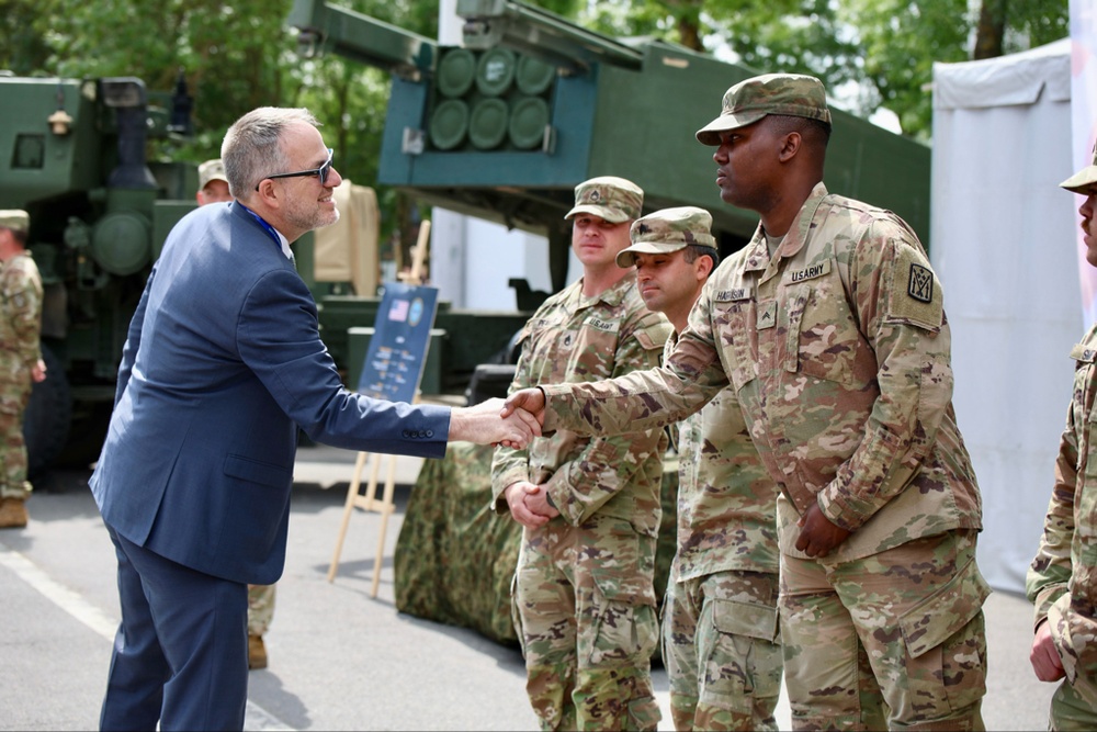 Deputy Chief of Mission David McCawley speaks to 3rd ABCT soldiers at EUROSATORY 2024