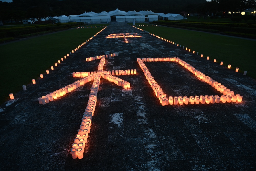 U.S. Navy volunteers commemorate Battle of Okinawa at Peace Memorial Park candle lighting