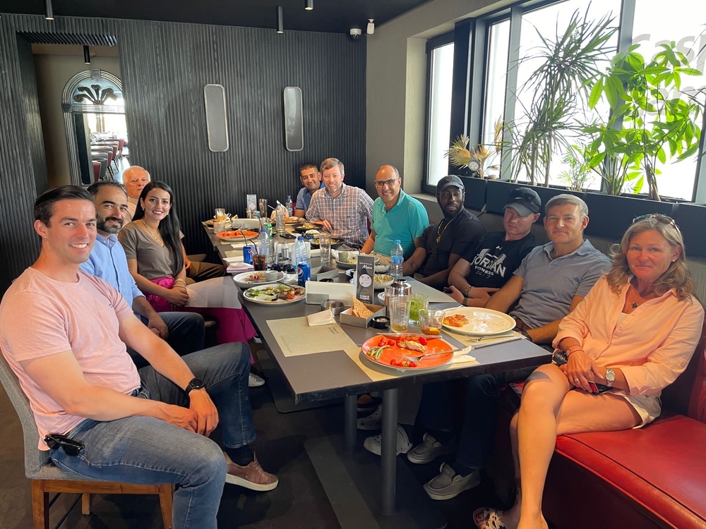 Capt. Pitsenberger (first on left) with Jordan area office staff enjoying a meal together.