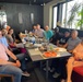 Capt. Pitsenberger (first on left) with Jordan area office staff enjoying a meal together.