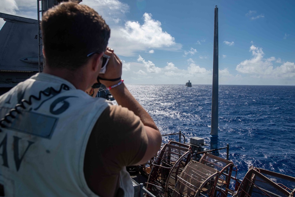 USS Ronald Reagan (CVN 76) conducts a fueling-at-sea and replenishment-at-sea with USNS Rappahannock (T-AO 204) and USNS Cesar Chavez (T-AKE-14)