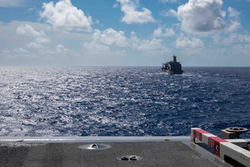 USS Ronald Reagan (CVN 76) conducts a fueling-at-sea and replenishment-at-sea with USNS Rappahannock (T-AO 204) and USNS Cesar Chavez (T-AKE-14)