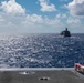 USS Ronald Reagan (CVN 76) conducts a fueling-at-sea and replenishment-at-sea with USNS Rappahannock (T-AO 204) and USNS Cesar Chavez (T-AKE-14)