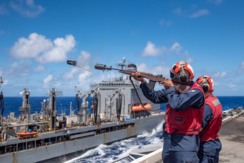 USS Ronald Reagan (CVN 76) conducts a fueling-at-sea and replenishment-at-sea with USNS Rappahannock (T-AO 204) and USNS Cesar Chavez (T-AKE-14)