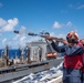 USS Ronald Reagan (CVN 76) conducts a fueling-at-sea and replenishment-at-sea with USNS Rappahannock (T-AO 204) and USNS Cesar Chavez (T-AKE-14)