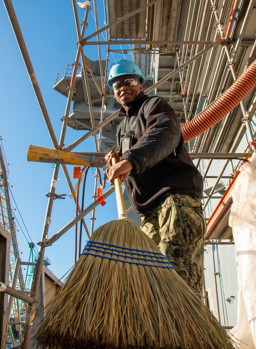 Sailor Sweeps Flight Deck