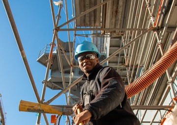 Sailor Sweeps Flight Deck