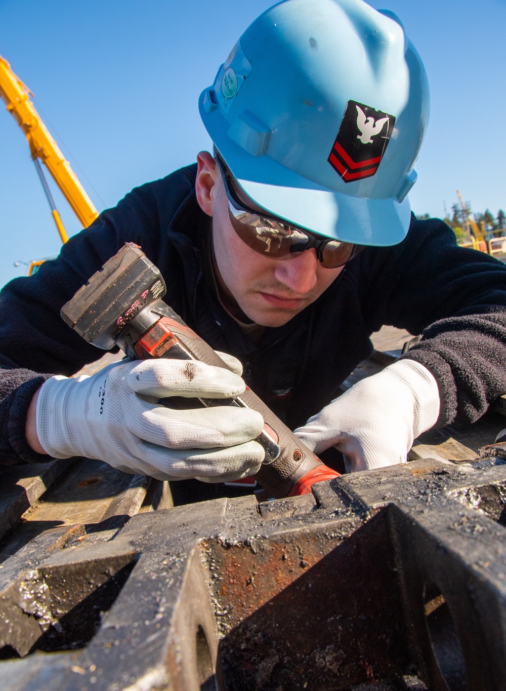 Sailor Performs Maintenance on Catapult Slide Assembly