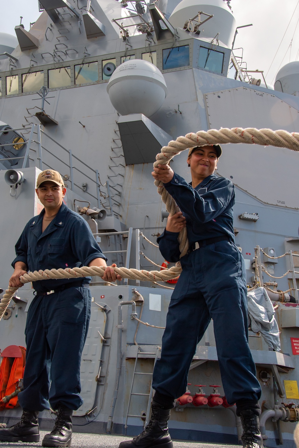 Sailor Removes Lines From Chocks