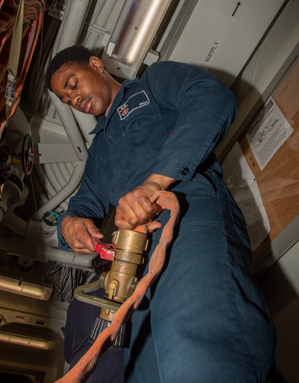 Sailor Inspects Damage Control Equipment