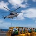 USS Ronald Reagan (CVN 76) conducts a fueling-at-sea and replenishment-at-sea with USNS Rappahannock (T-AO 204) and USNS Cesar Chavez (T-AKE-14)