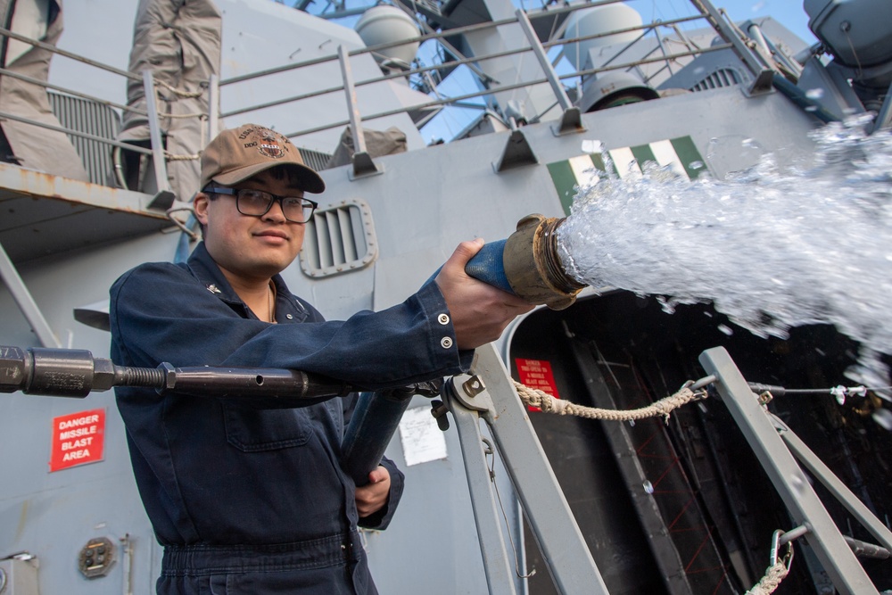 Sailor Flushes Out Hose