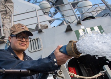 Sailor Flushes Out Hose